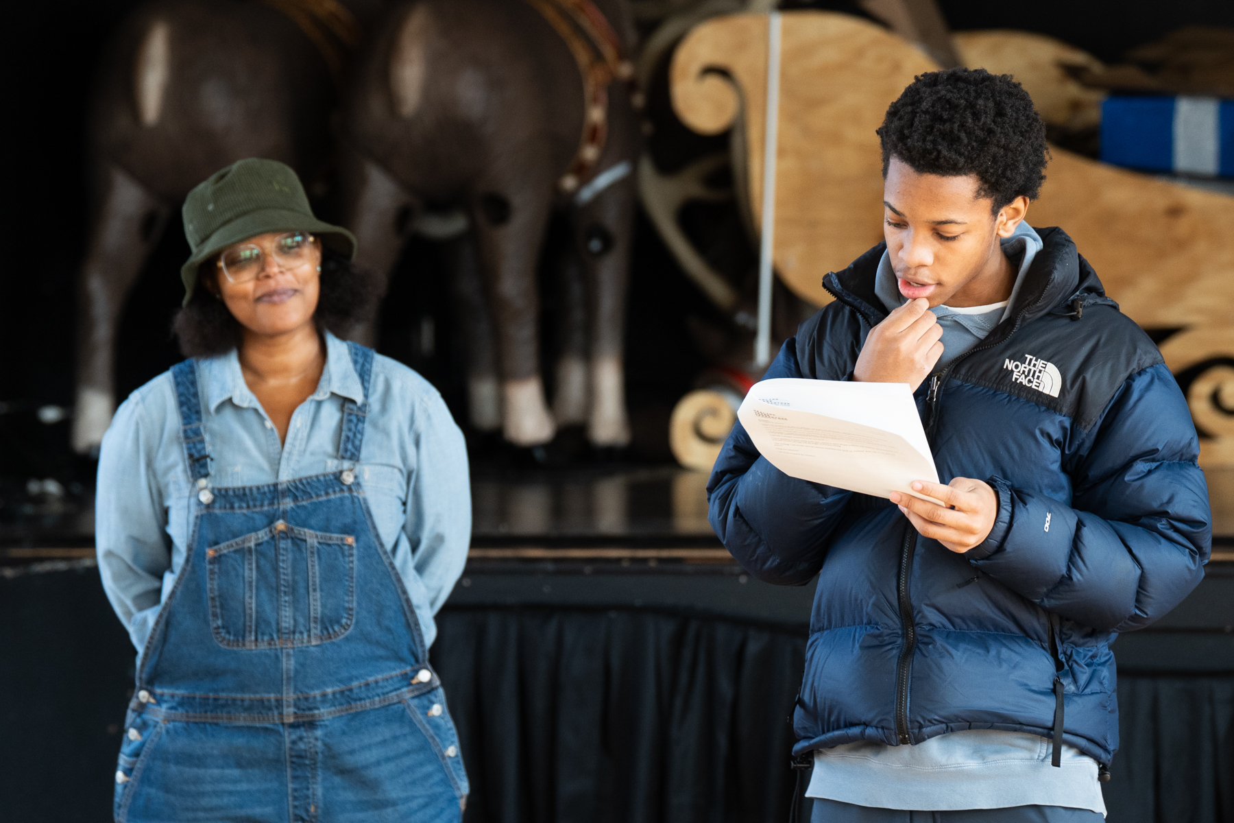 Yolanda Wisher listens to youth poet reciting their writing during Youth Poetry Workshop at Lonnie Young Recreation Center. Photo courtesy Terrell Halsey / Embassy Interactive.